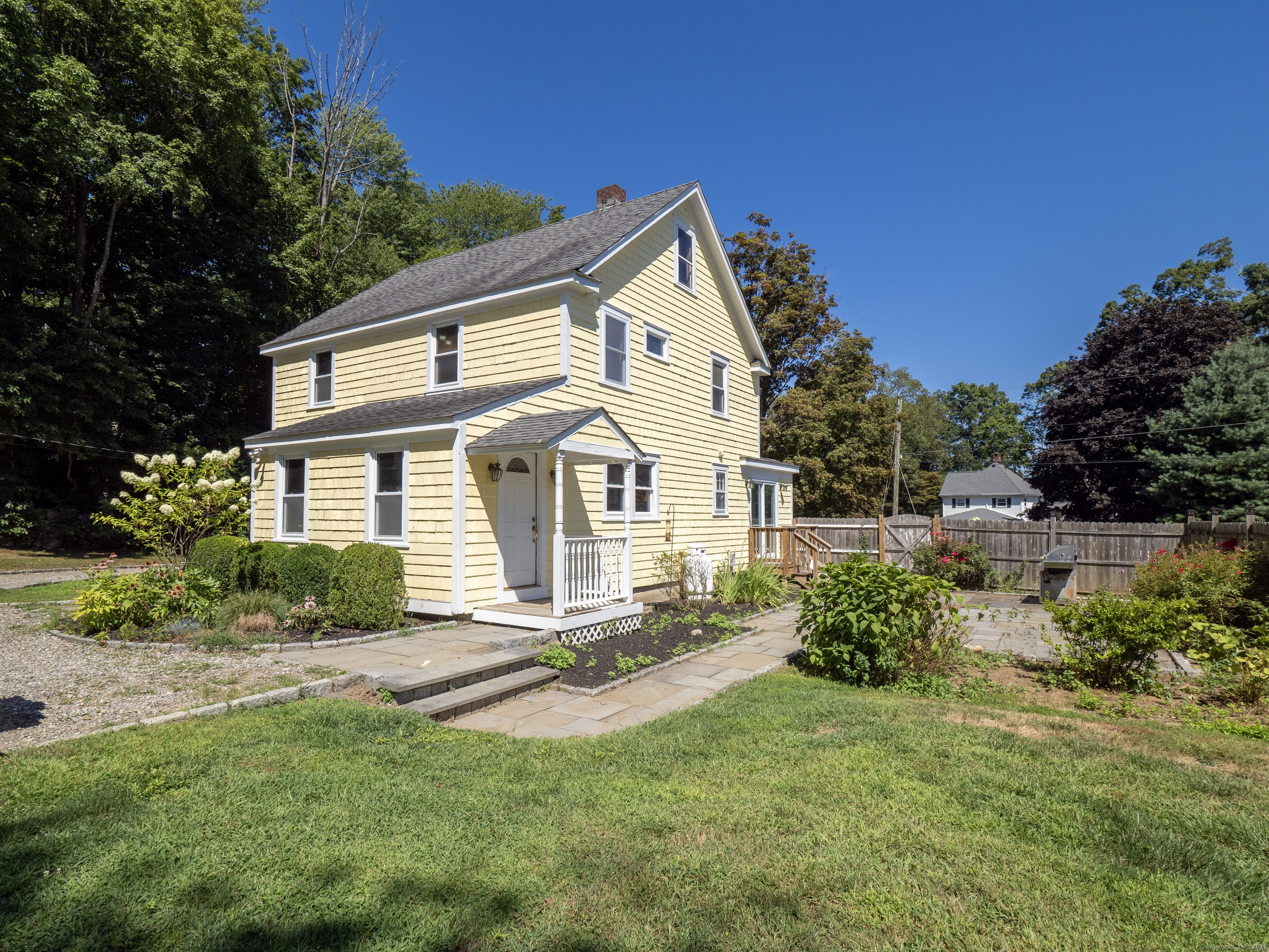 159 Barry Avenue Ridgefield, CT 06877 - Photo 26 of 39 a front view of a house with a yard