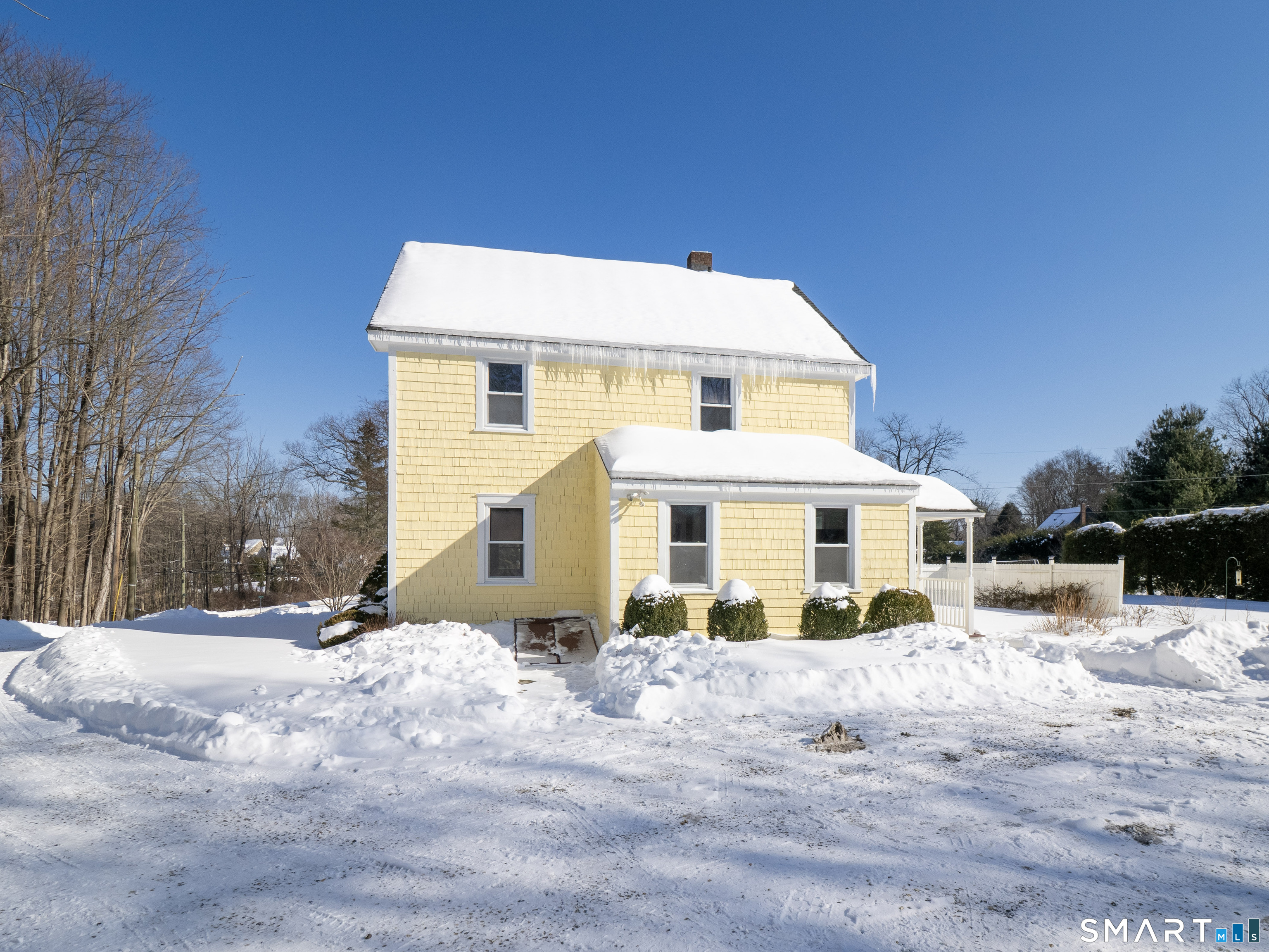 159 Barry Avenue Ridgefield, CT 06877 - Photo 29 of 39 a view of a white house with a yard