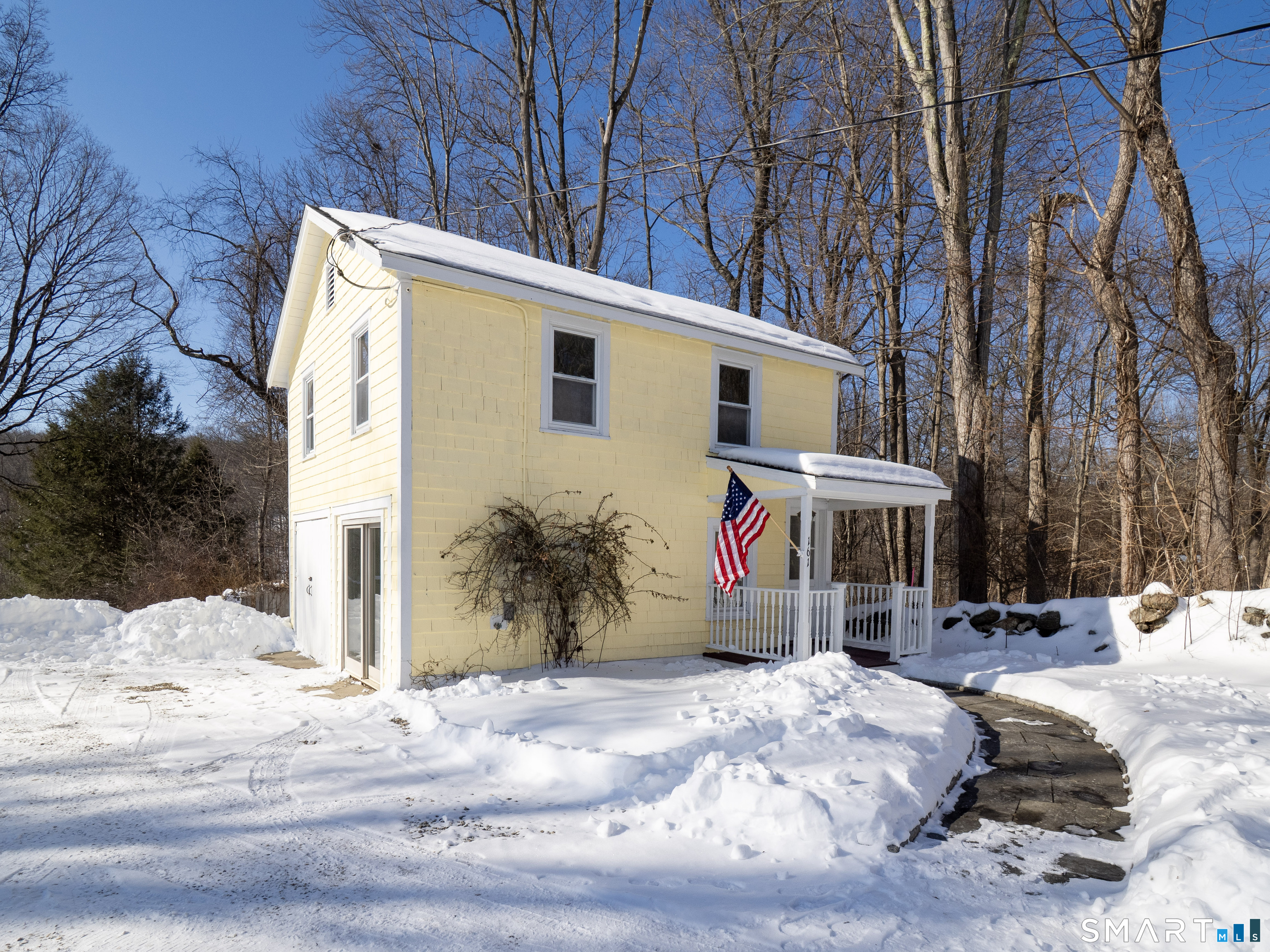 159 Barry Avenue Ridgefield, CT 06877 - Photo 34 of 39 a view of a house with snow on the road