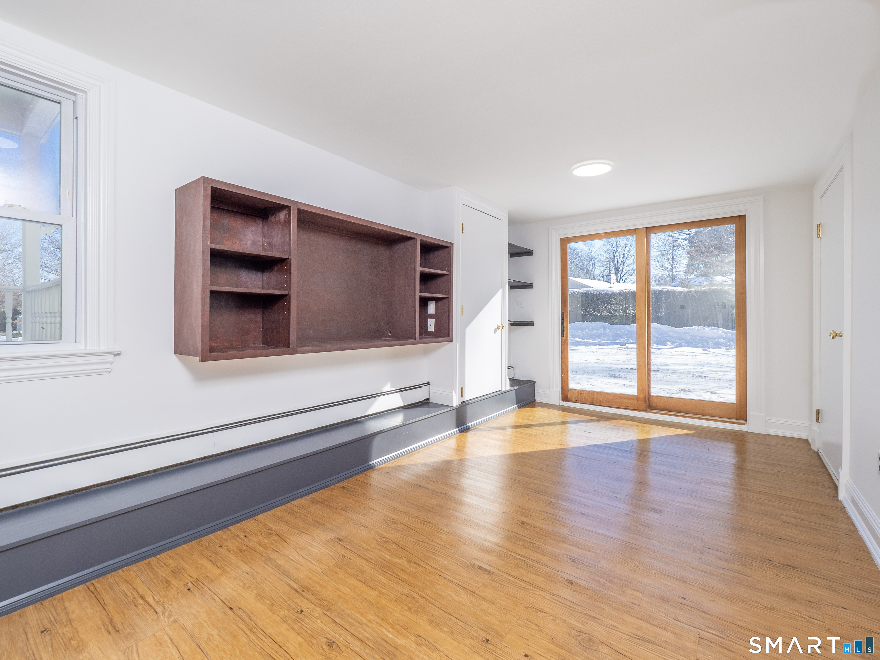 159 Barry Avenue Ridgefield, CT 06877 - Photo 35 of 39 a view of an empty room with a window and wooden floor