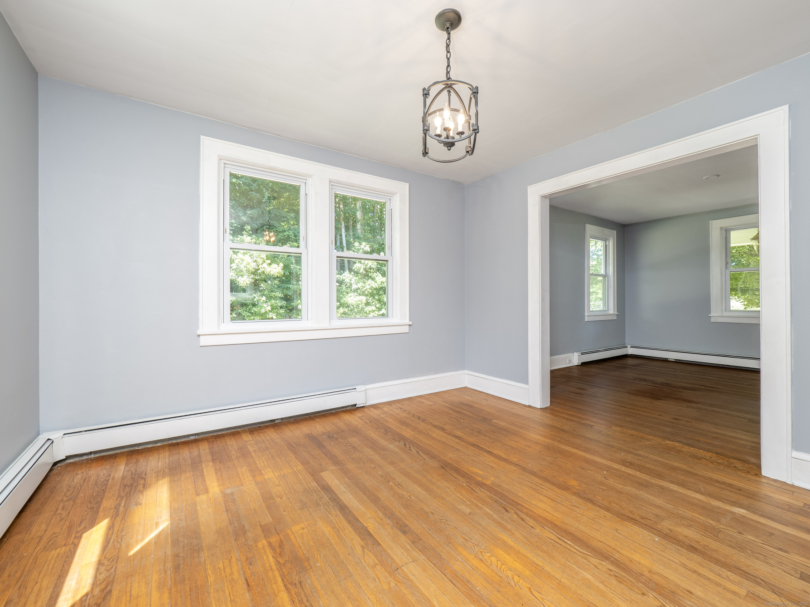 159 Barry Avenue Ridgefield, CT 06877 - Photo 8 of 39 a view of empty room with wooden floor and fan