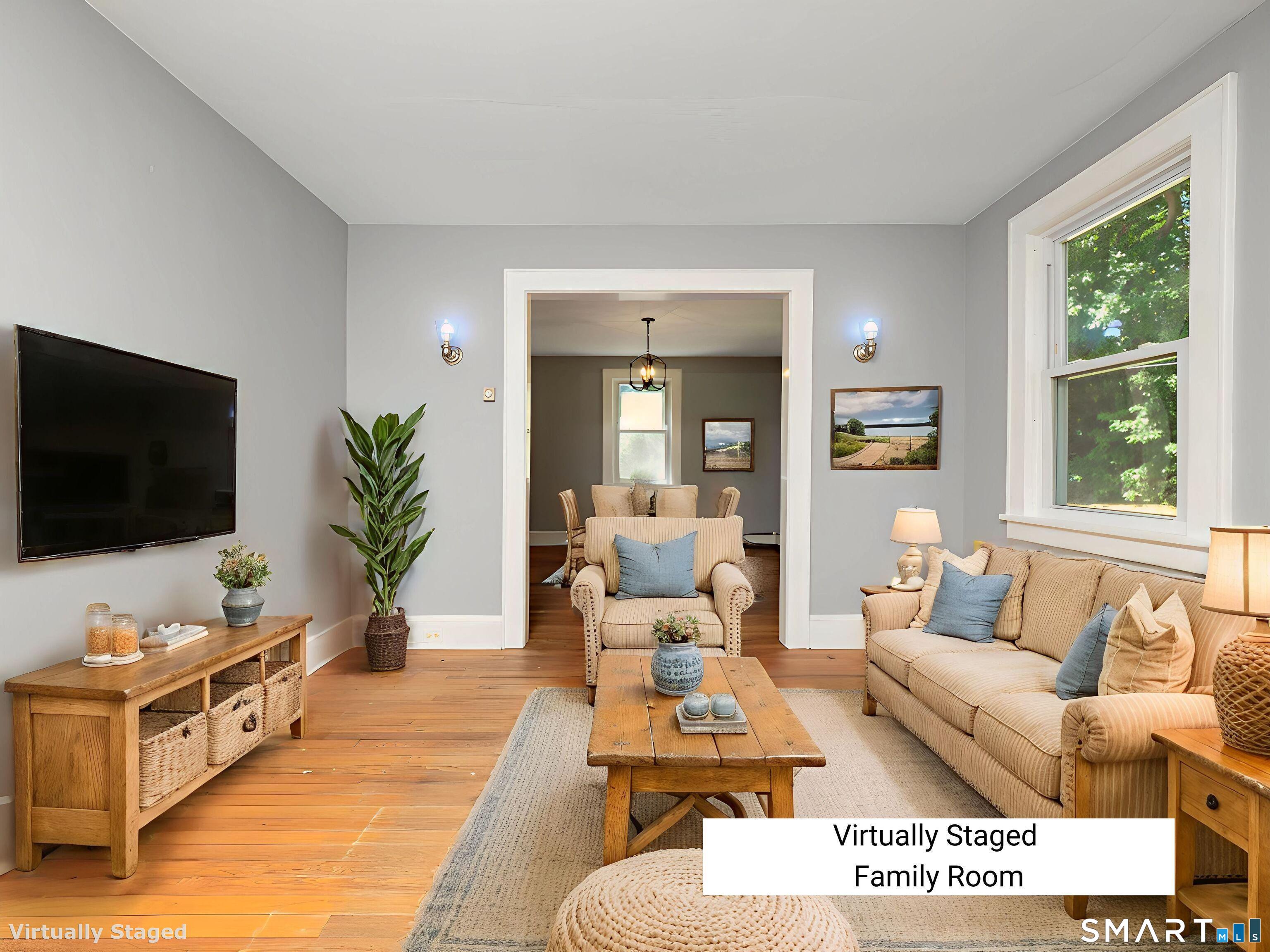 159 Barry Avenue Ridgefield, CT 06877 - Photo 9 of 39 a living room with furniture and a flat screen tv