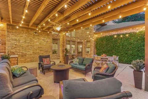 a outdoor living space with patio furniture and garden view