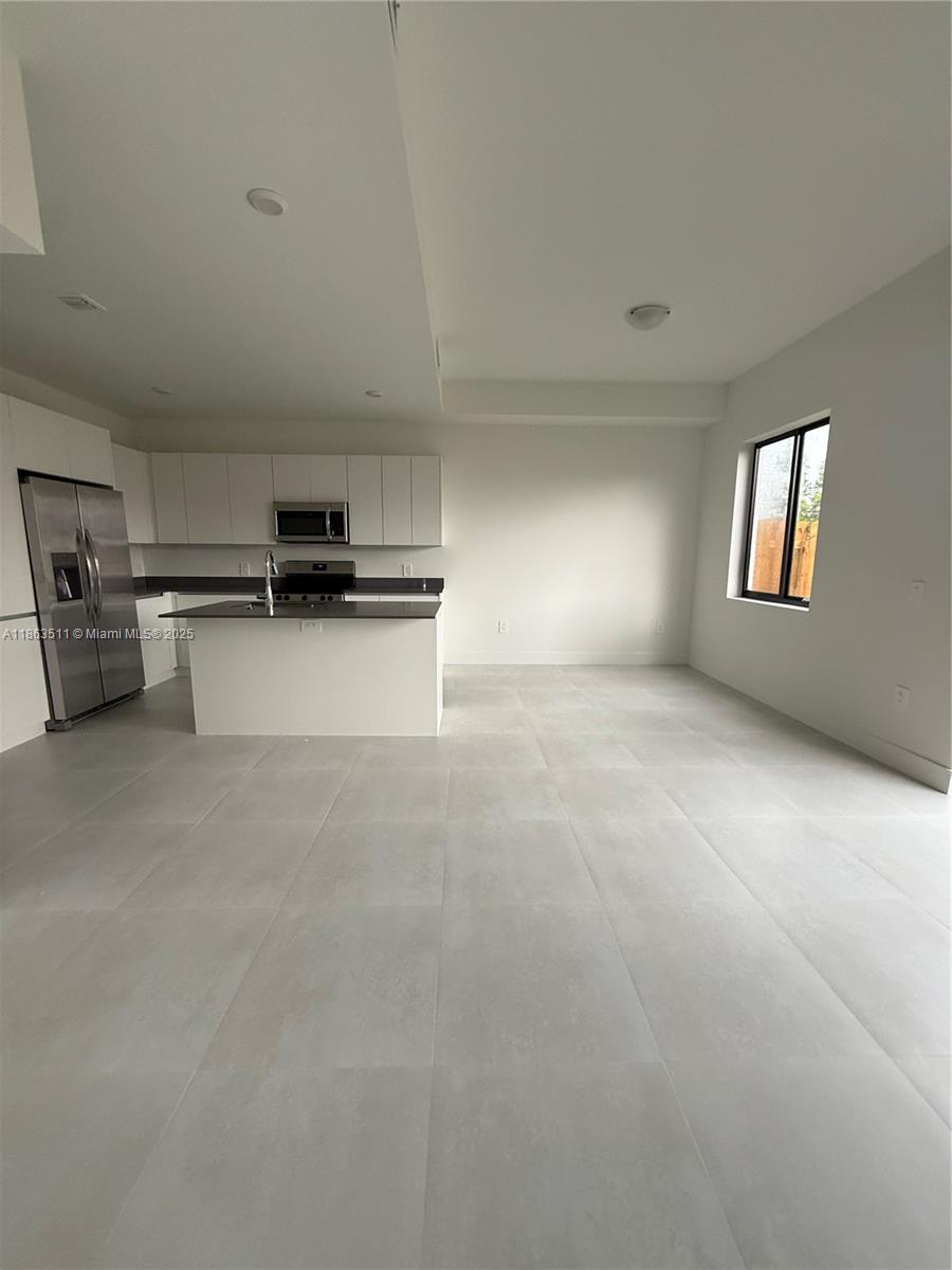 18988 Southwest 344th Terrace Homestead, FL 33034 - Photo 12 of 28 a view of a kitchen with appliances and cabinets