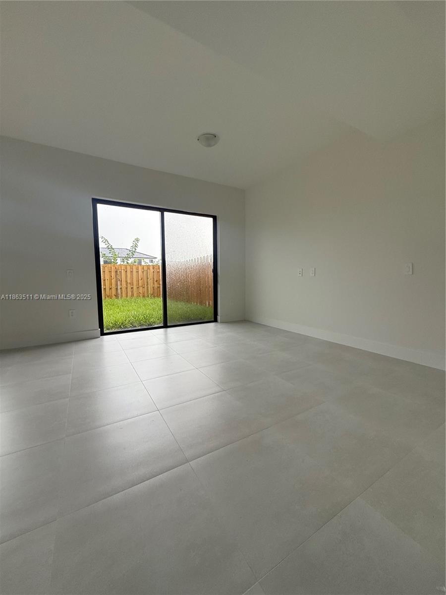 18988 Southwest 344th Terrace Homestead, FL 33034 - Photo 13 of 28 a view of empty room