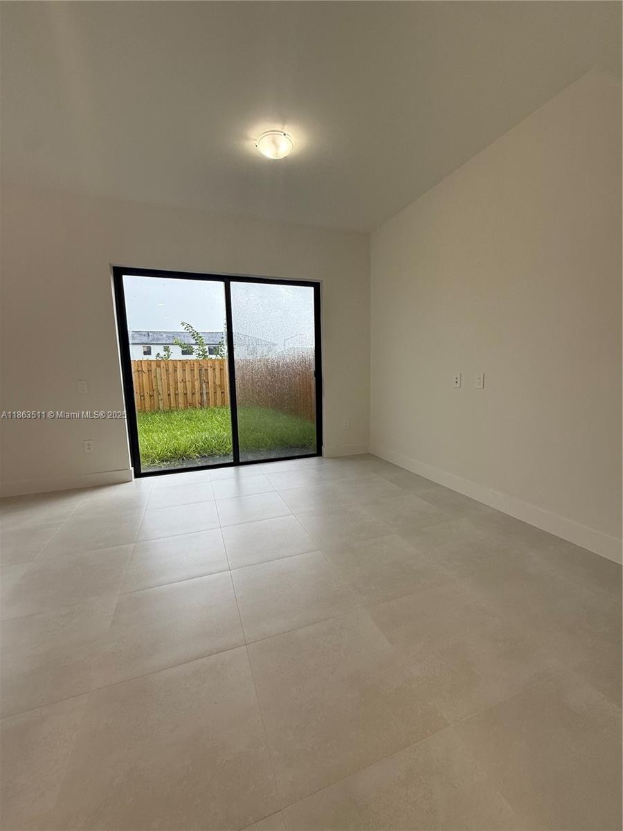 18988 Southwest 344th Terrace Homestead, FL 33034 - Photo 14 of 28 a view of an empty room with a balcony