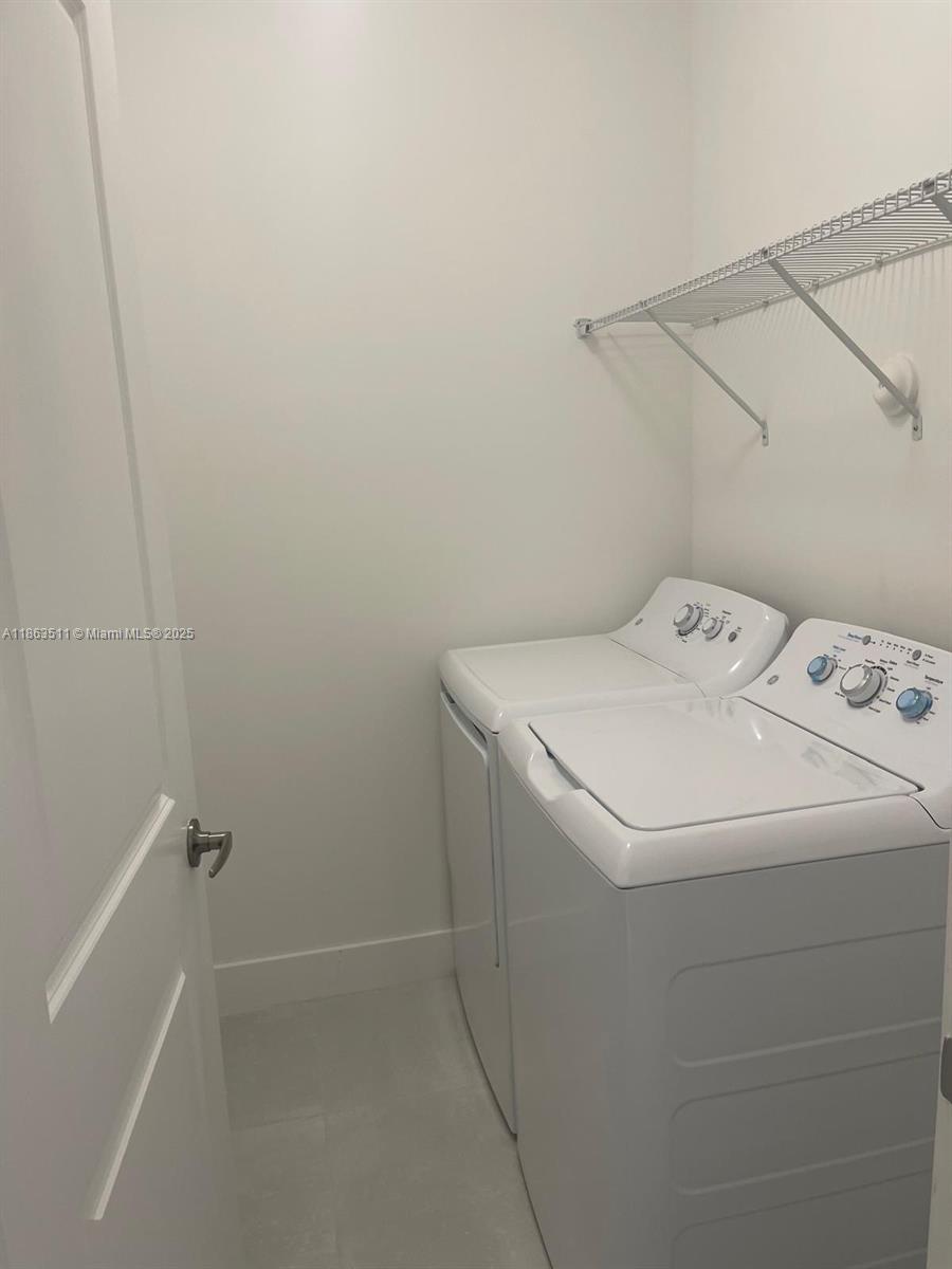 18988 Southwest 344th Terrace Homestead, FL 33034 - Photo 16 of 28 a utility room with dryer and washer