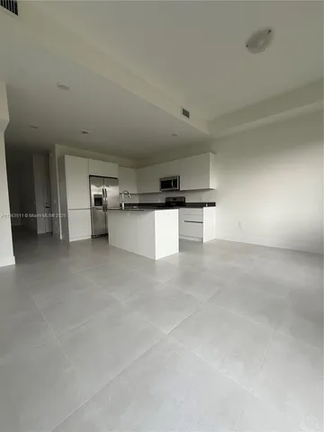a view of a kitchen with a sink