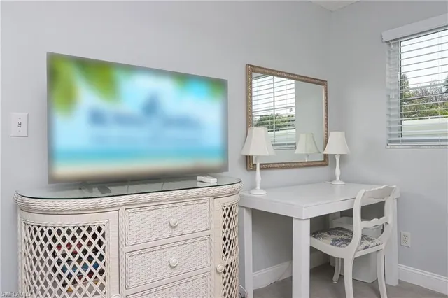 a kitchen with a wooden floor and cabinets