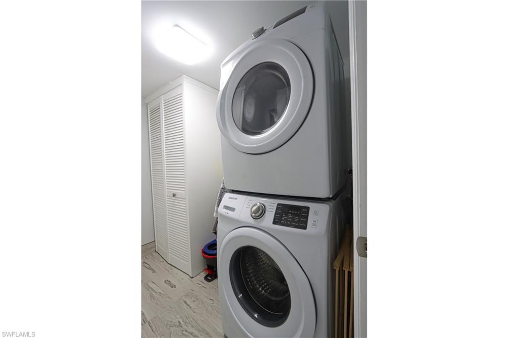 4200 Belair Lane, Unit 114 Naples, FL 34103 - Photo 15 of 22 a utility room with dryer and washer