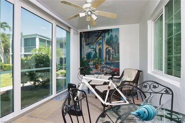a view of a patio with table and chairs