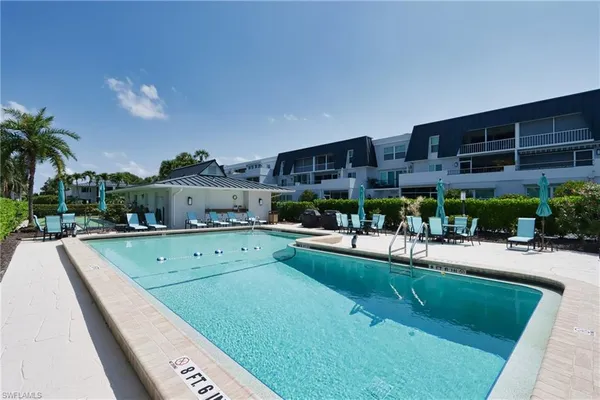 a view of a swimming pool with a patio