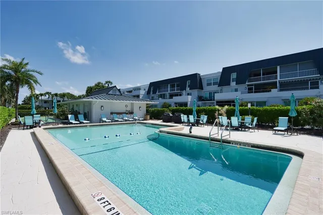 a view of a swimming pool with a patio