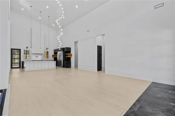 a kitchen with stainless steel appliances wooden cabinets and a stove top oven