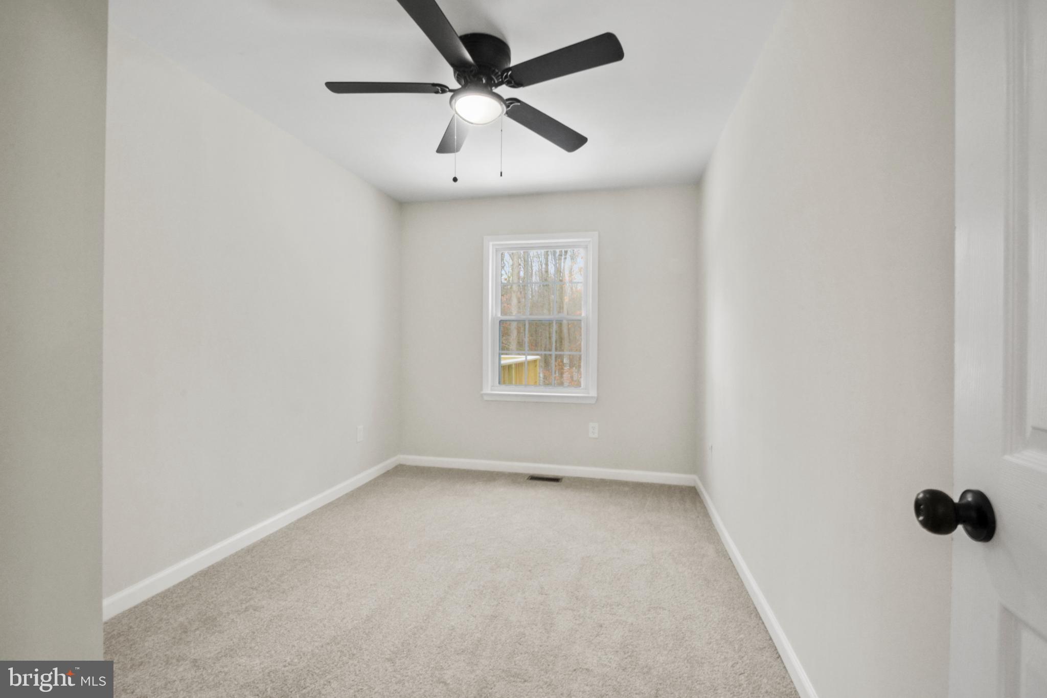 18487 Clay Hill Road Stevensburg, VA 22741 - Photo 26 of 41 an empty room with a window and a ceiling fan