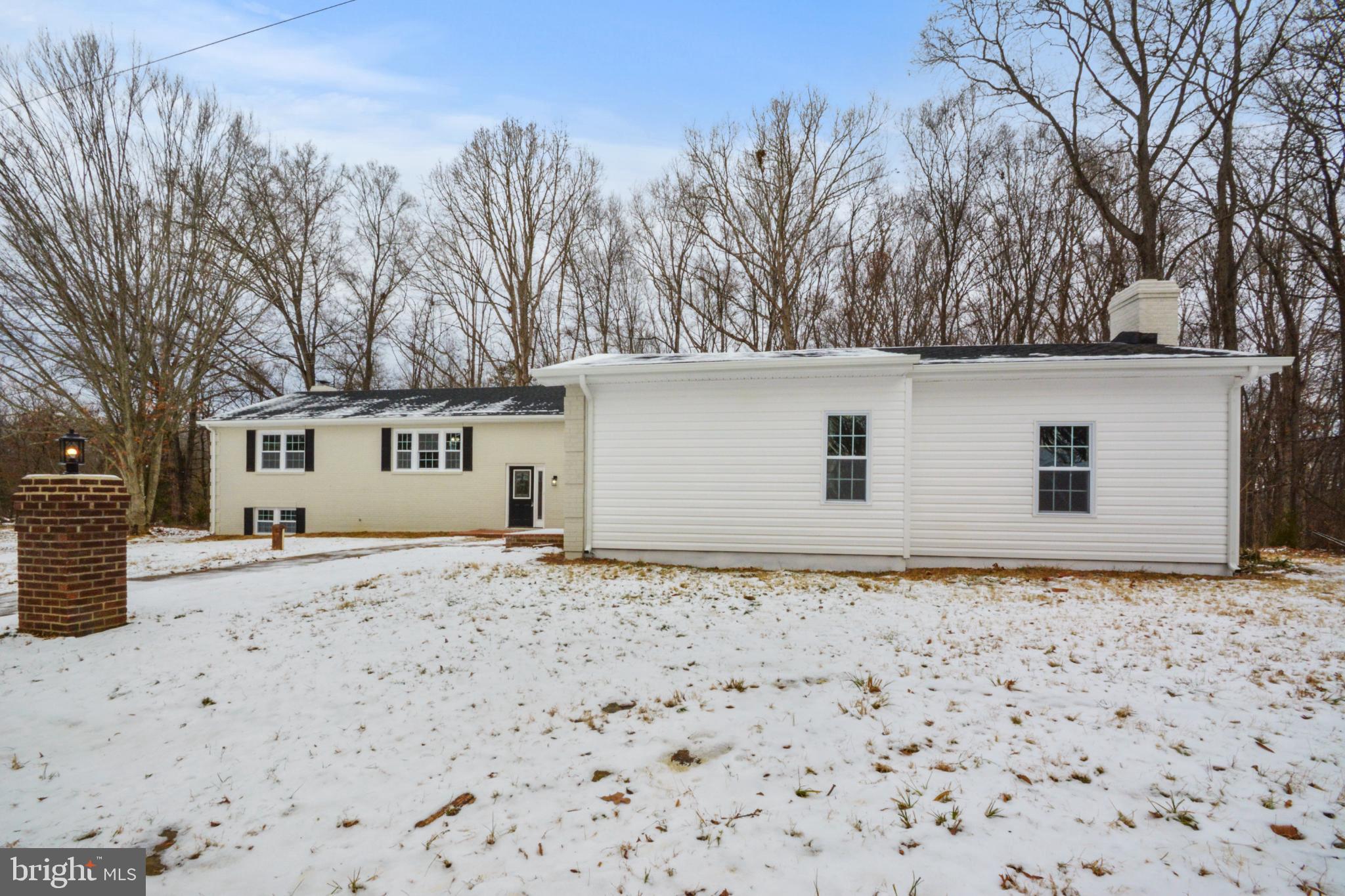 18487 Clay Hill Road Stevensburg, VA 22741 - Photo 4 of 41 a house with trees in front of it
