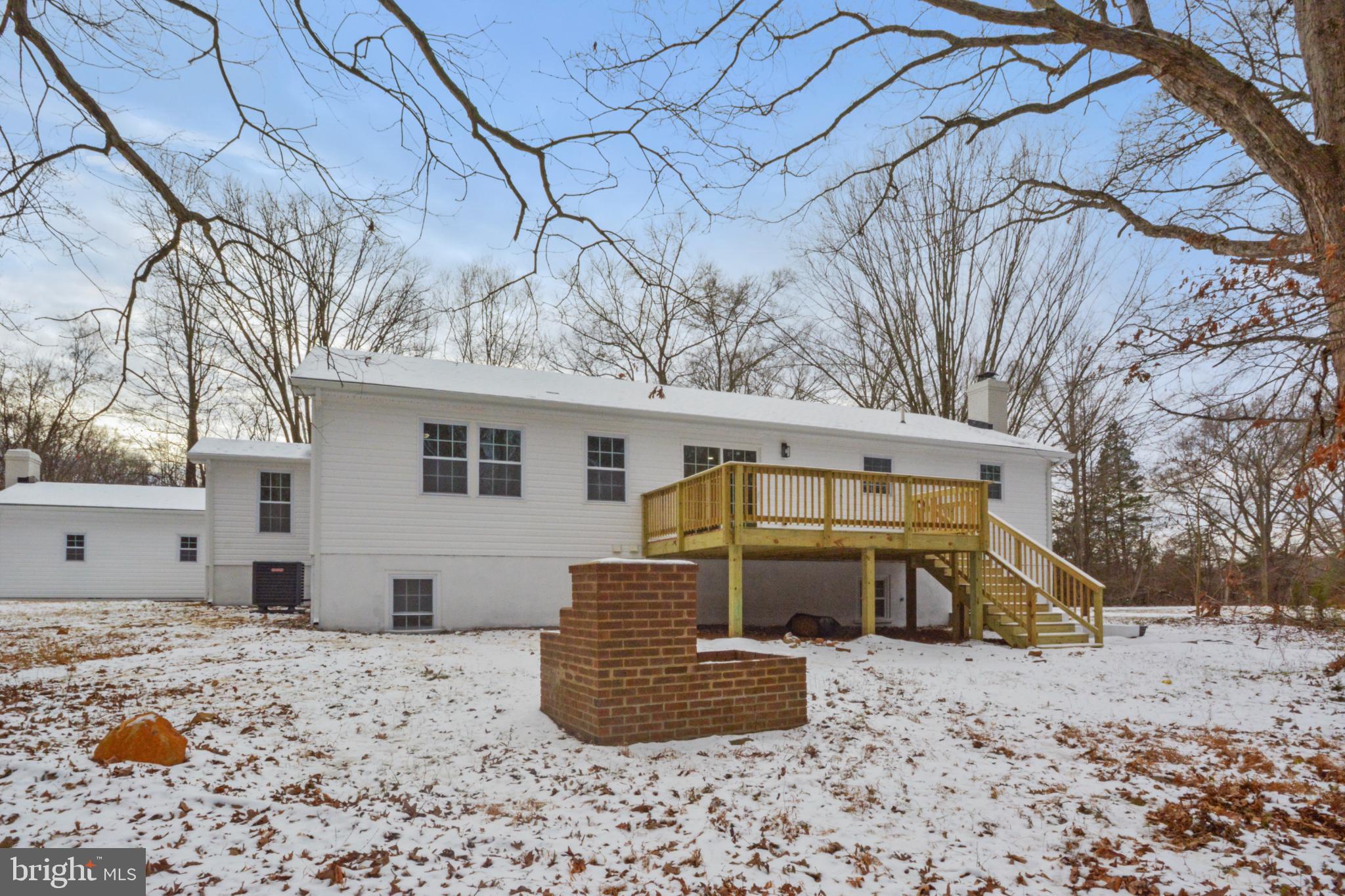 18487 Clay Hill Road Stevensburg, VA 22741 - Photo 6 of 41 a view of a backyard with large tree