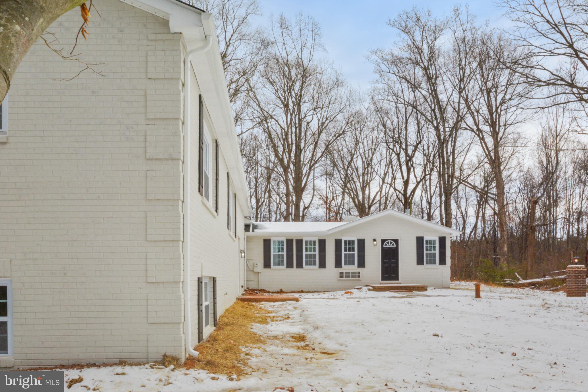 18487 Clay Hill Road Stevensburg, VA 22741 - Photo 8 of 41 a front view of a house with a dirt yard