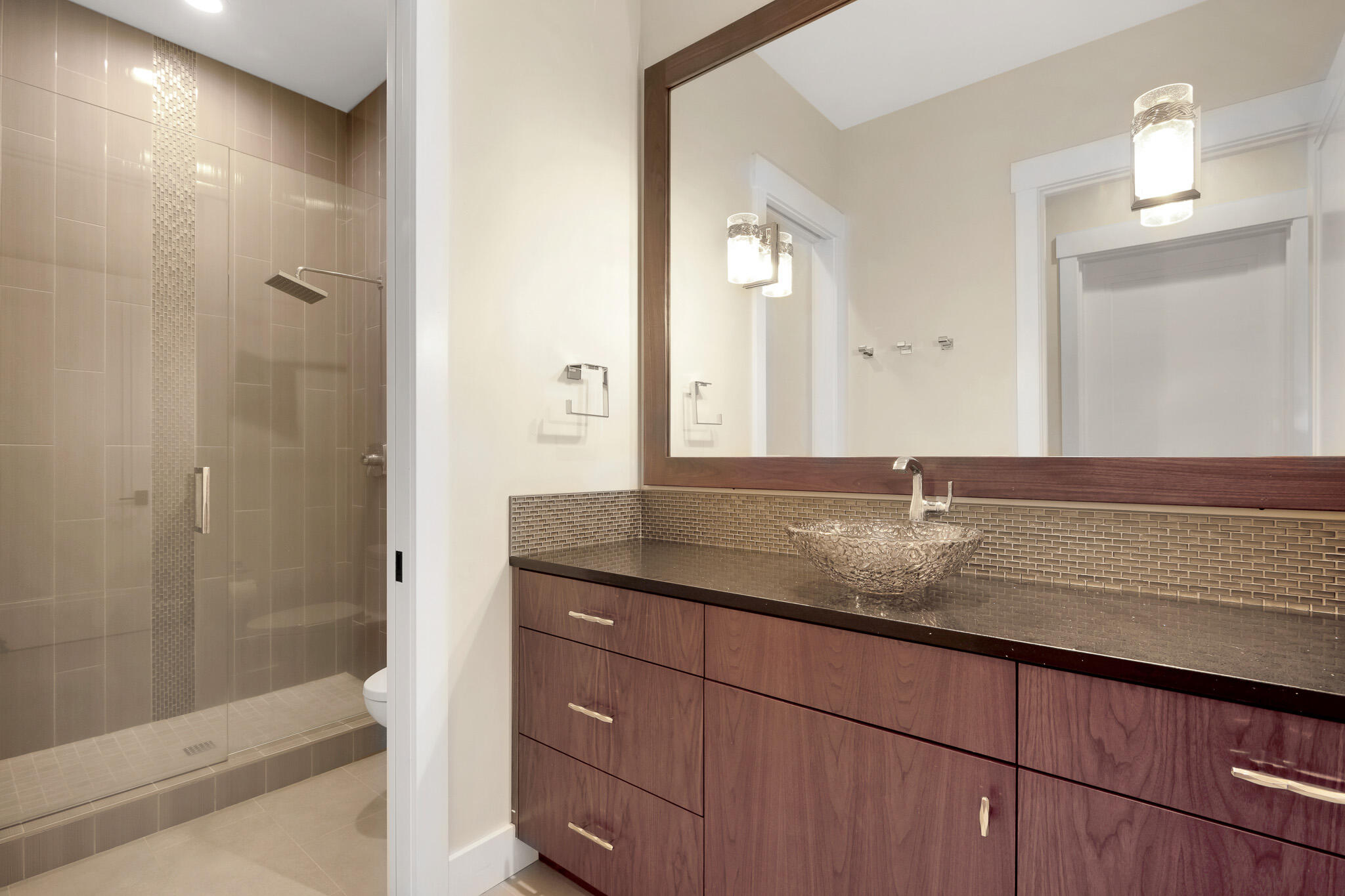 60871 River Rim Drive Bend, OR 97702 - Photo 33 of 42 a bathroom with a granite countertop sink and a mirror