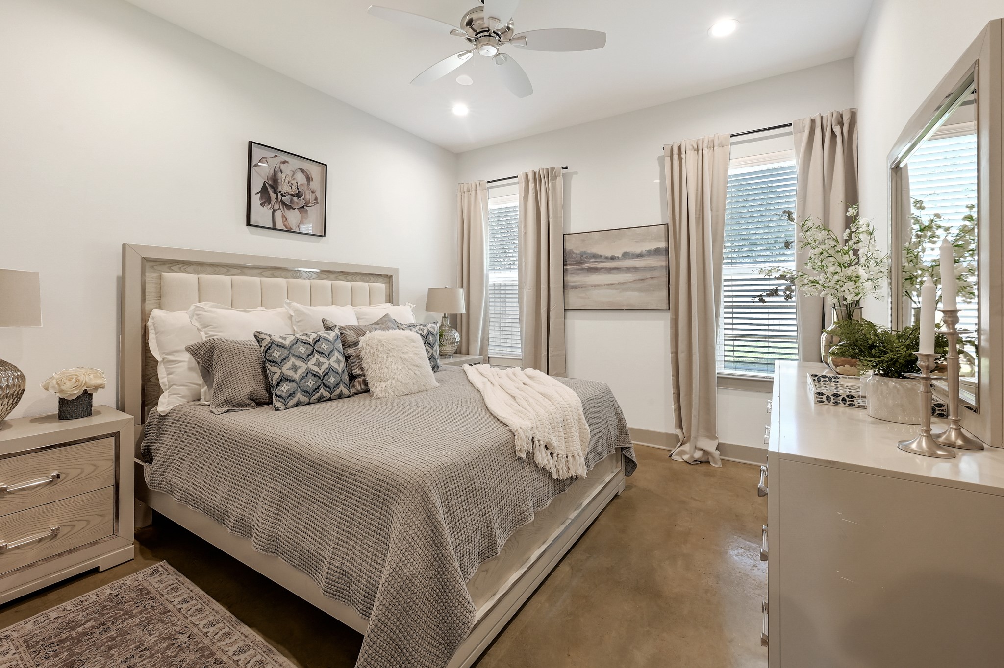 33455 Buckshot Lane, Unit 4 Spring, TX 77382 - Photo 8 of 25 a bedroom with a large bed and a chandelier fan