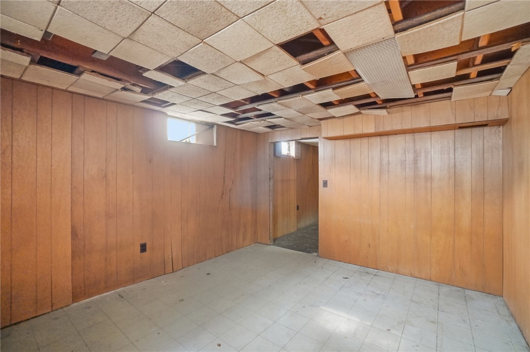 1087 Fairfield Road Troy, OH 45373 - Photo 30 of 39 This spacious room with classic wood paneling offers endless possibilities for customization.