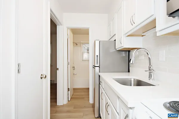 a bathroom with a sink and mirror