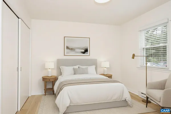 a bedroom with a bed and a couch