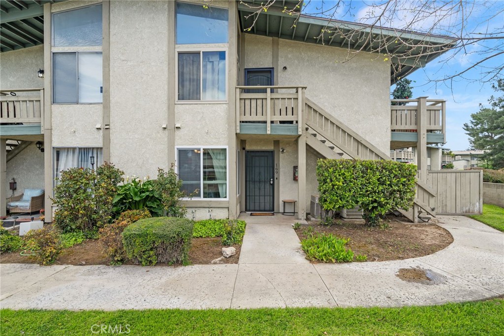 1800 East Old Ranch Road, Unit 169 Colton, CA 92324 - Photo 1 of 1 a front view of a house with garden