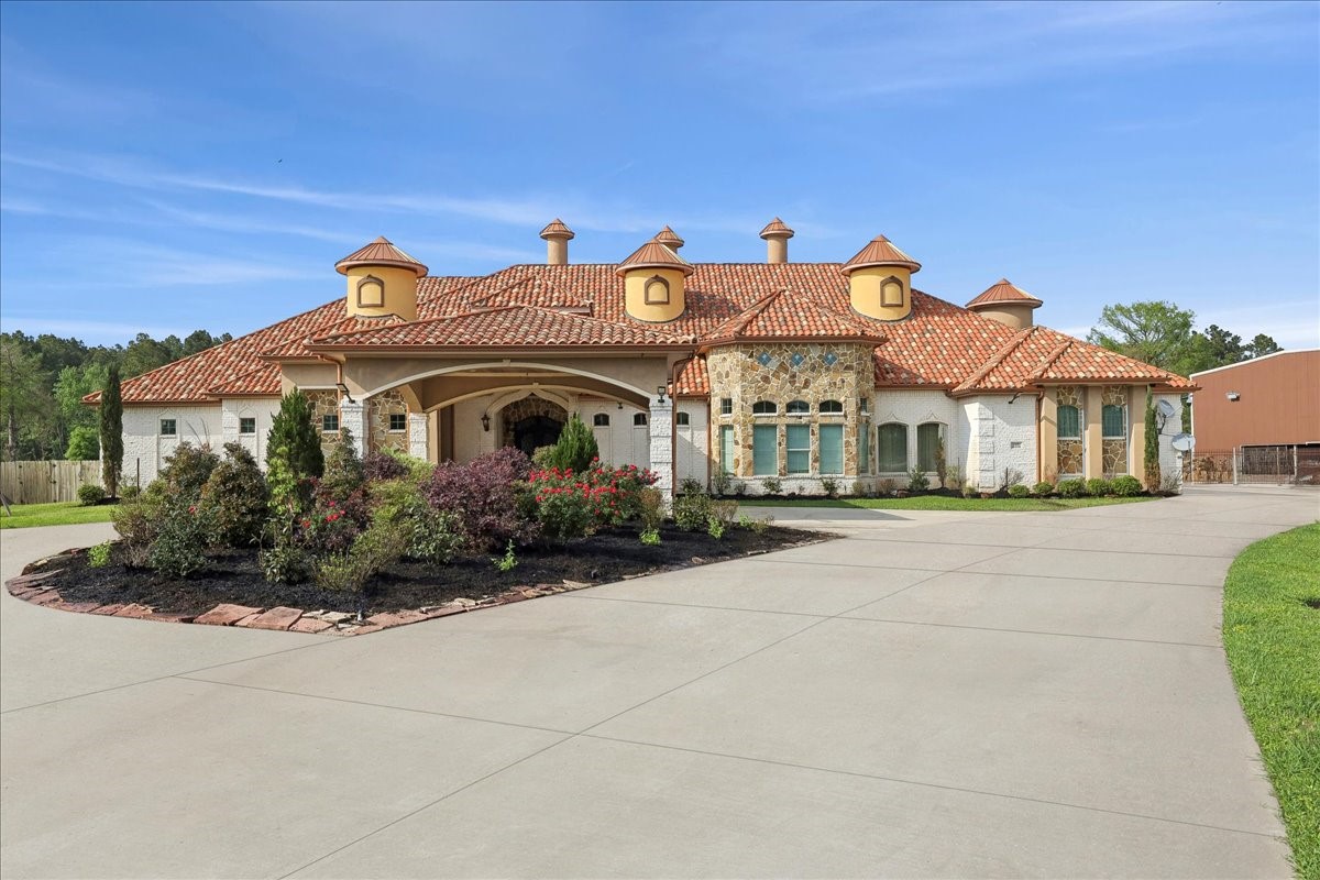 a front view of a residential houses with yard
