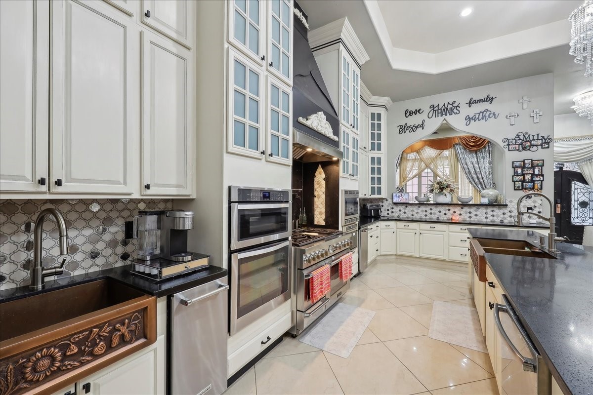 12460 Keith Road Beaumont, TX 77713 - Photo 12 of 40 a kitchen with stainless steel appliances granite countertop a stove and a sink