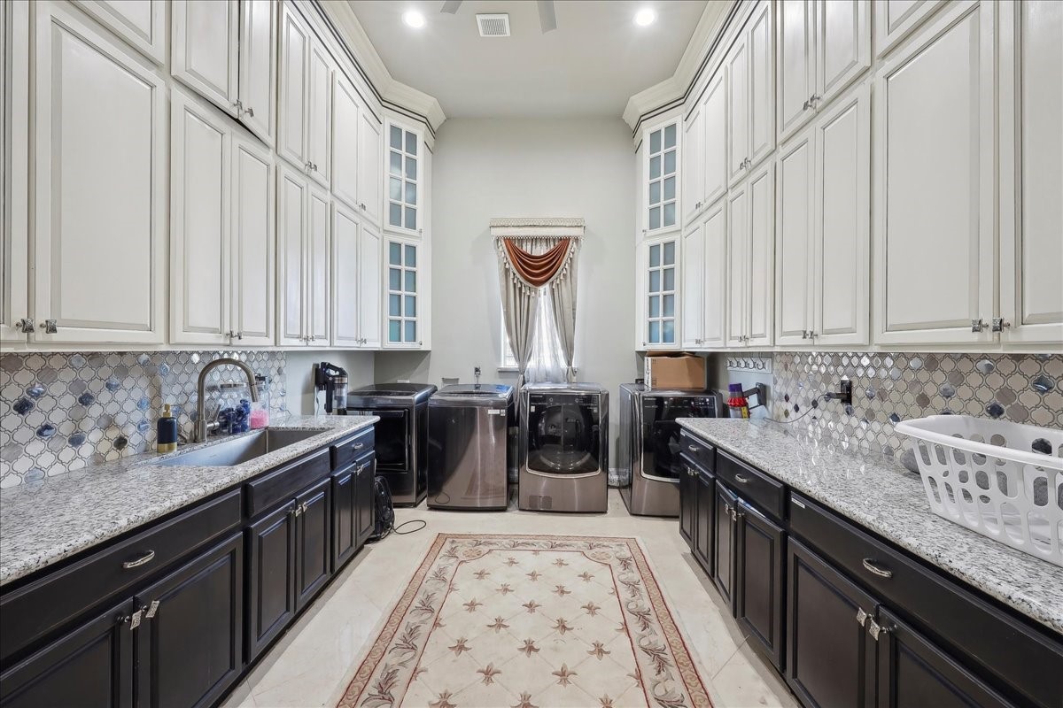 12460 Keith Road Beaumont, TX 77713 - Photo 16 of 40 a kitchen with a sink and a stove top oven