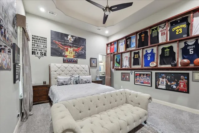 a living room with furniture a book shelf and a book shelf