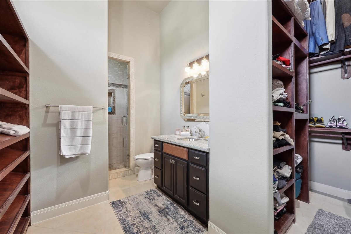 12460 Keith Road Beaumont, TX 77713 - Photo 21 of 40 walk in closet with clothes and shoes