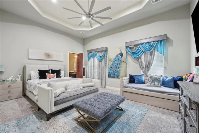 a bedroom with a large bed and a couch