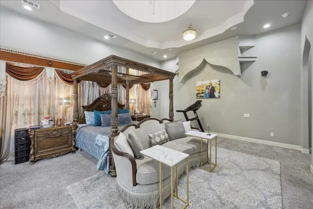a living room with fireplace furniture and a large window