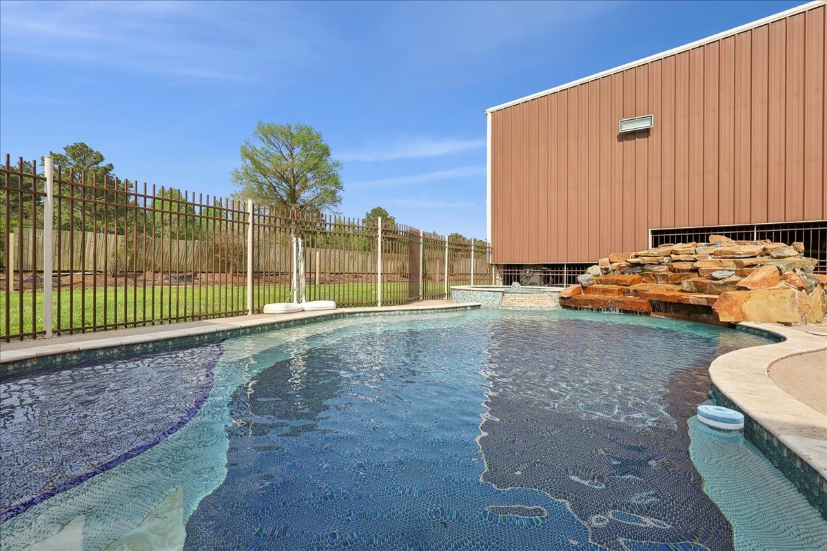 12460 Keith Road Beaumont, TX 77713 - Photo 37 of 40 a view of a backyard with a large tree and wooden fence