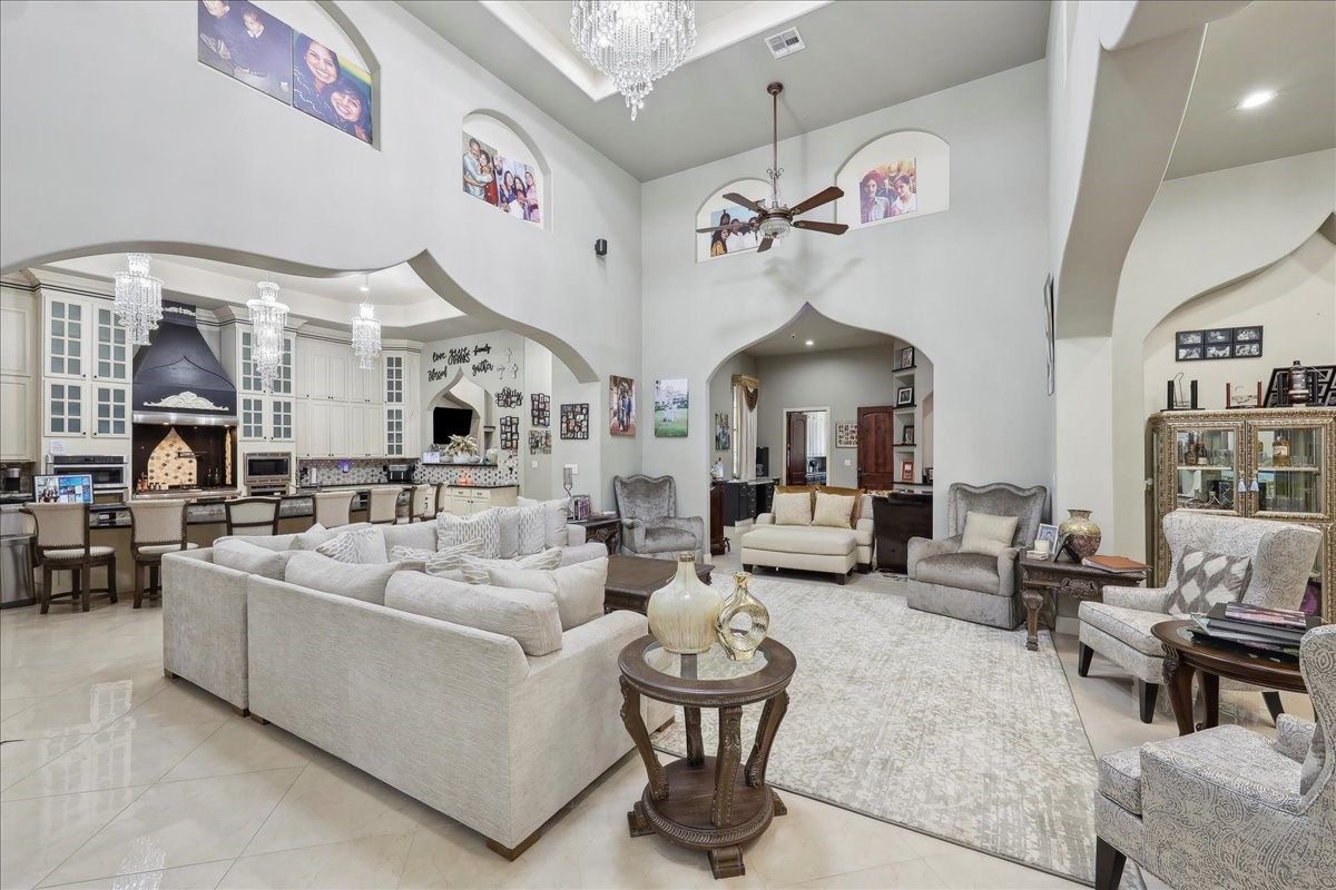 12460 Keith Road Beaumont, TX 77713 - Photo 4 of 40 a living room with furniture and a chandelier