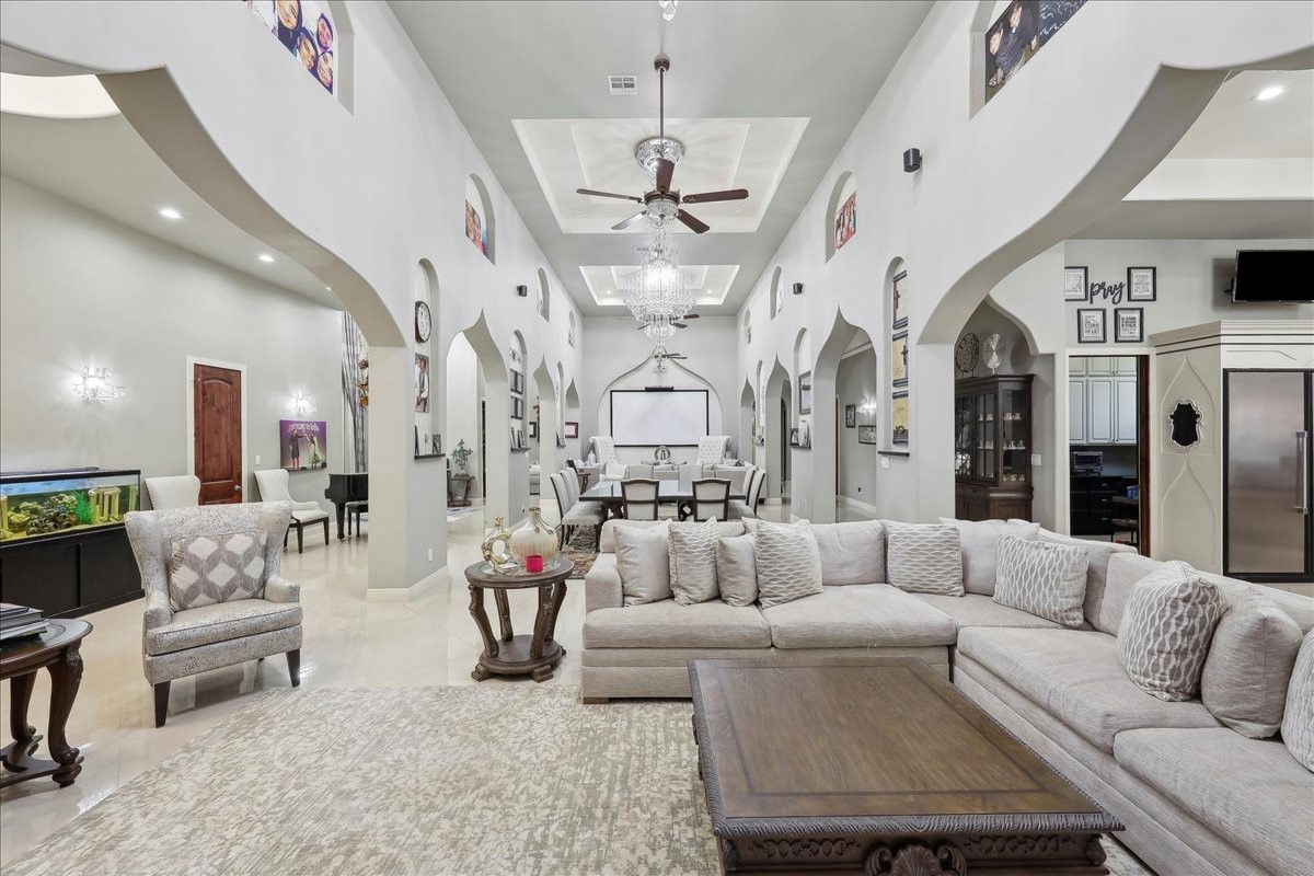 12460 Keith Road Beaumont, TX 77713 - Photo 5 of 40 a living room with patio furniture and a chandelier