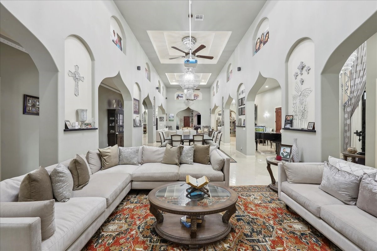 12460 Keith Road Beaumont, TX 77713 - Photo 6 of 40 a living room with patio furniture and a chandelier