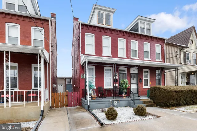 a view of a brick building with many windows