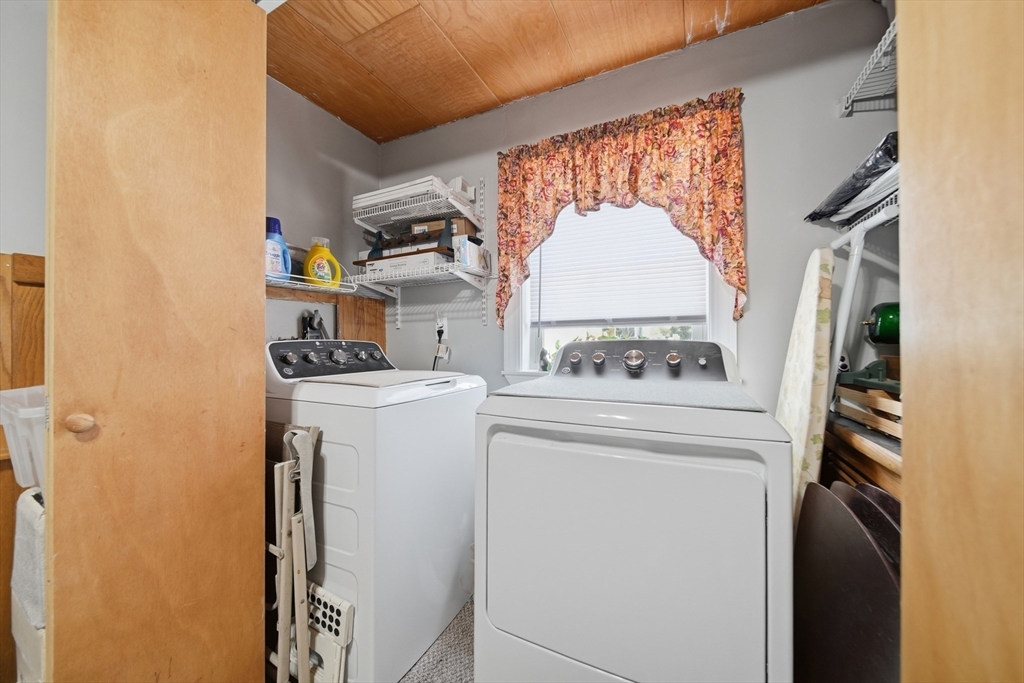436 Franklin Road Fitchburg, MA 01420 - Photo 19 of 41 a view of washer and dryer with kitchen in the background