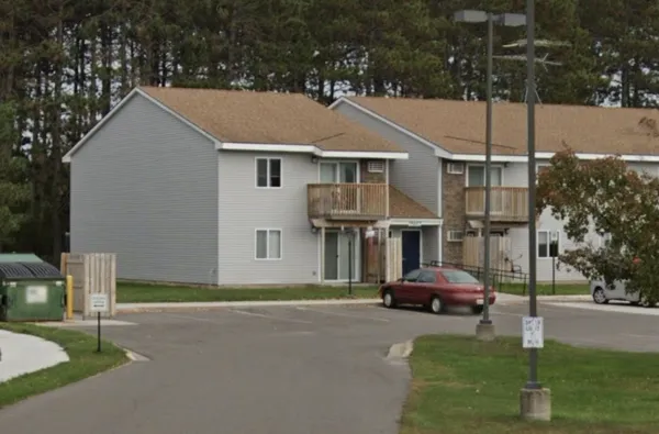 a car parked in front of white house