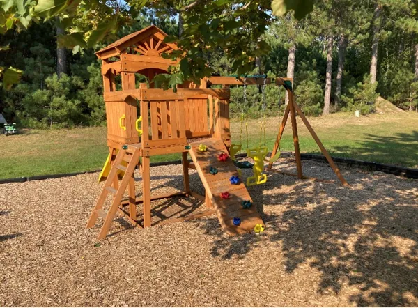 an aerial view of a house with a yard