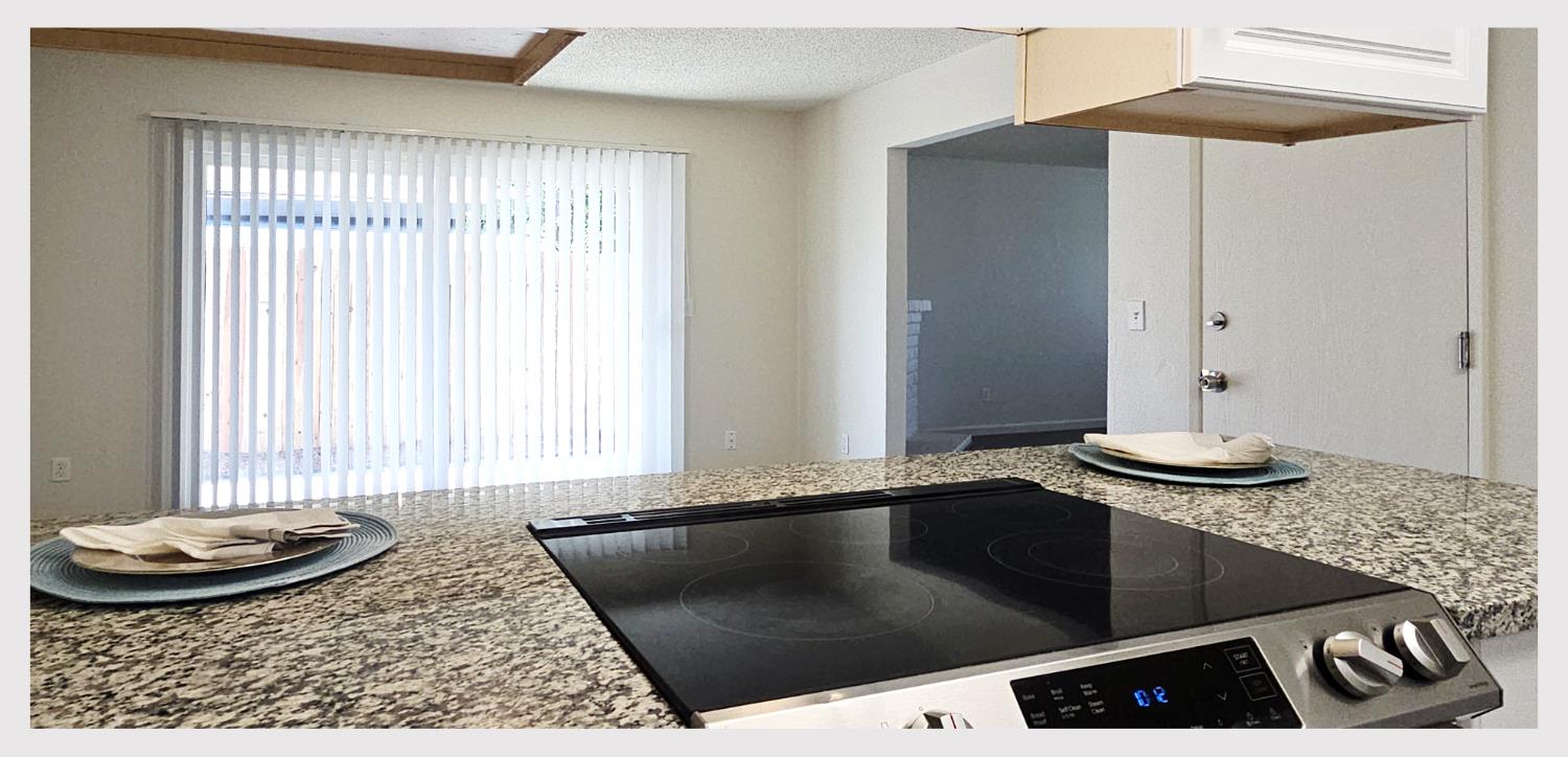 5130 Rescue Court Sacramento, CA 95841 - Photo 13 of 47 a kitchen with a sink and a stove top oven