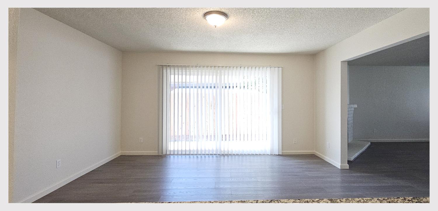 5130 Rescue Court Sacramento, CA 95841 - Photo 17 of 47 an empty room with wooden floor and windows