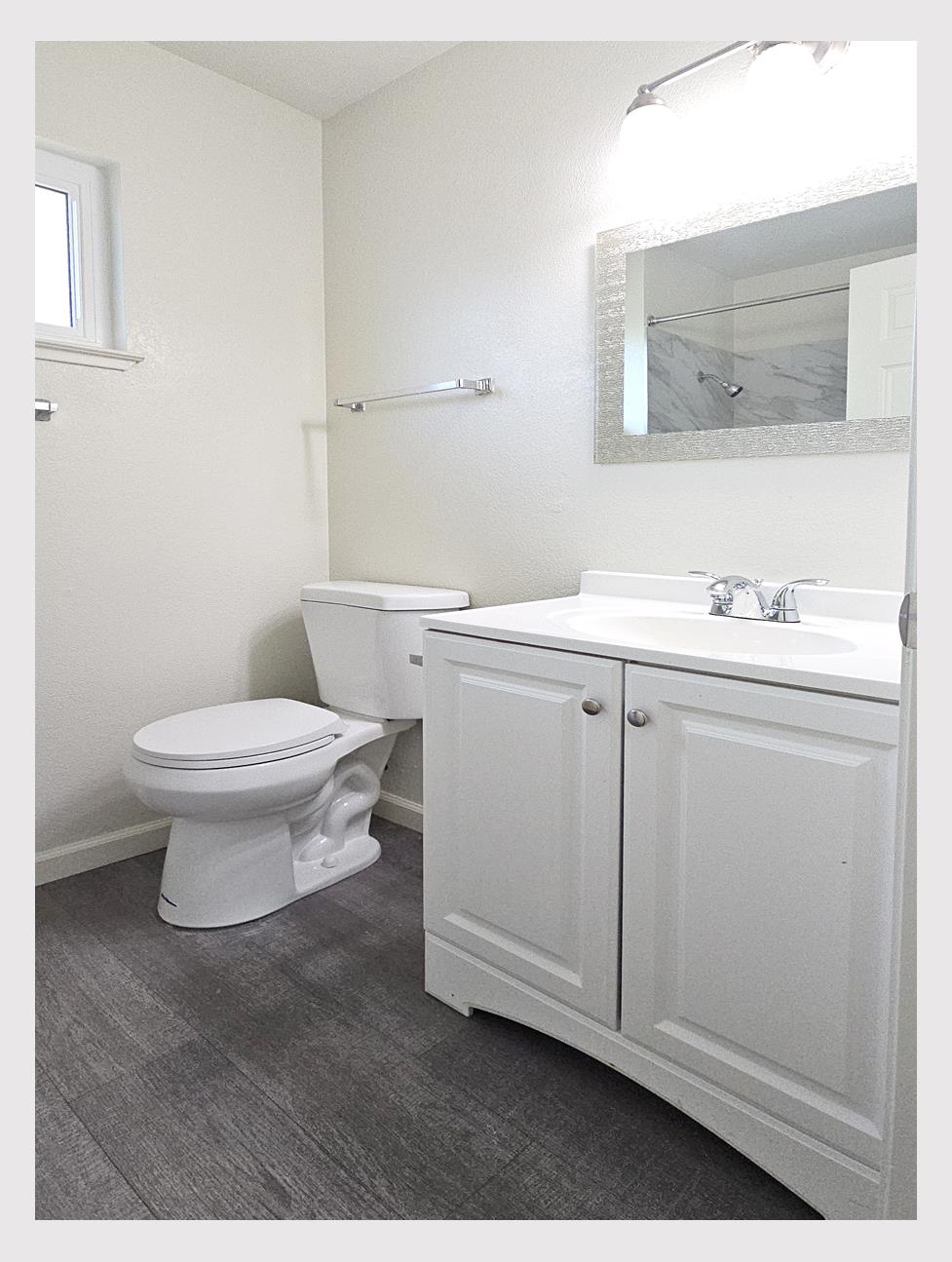 5130 Rescue Court Sacramento, CA 95841 - Photo 20 of 47 a bathroom with a sink toilet and mirror