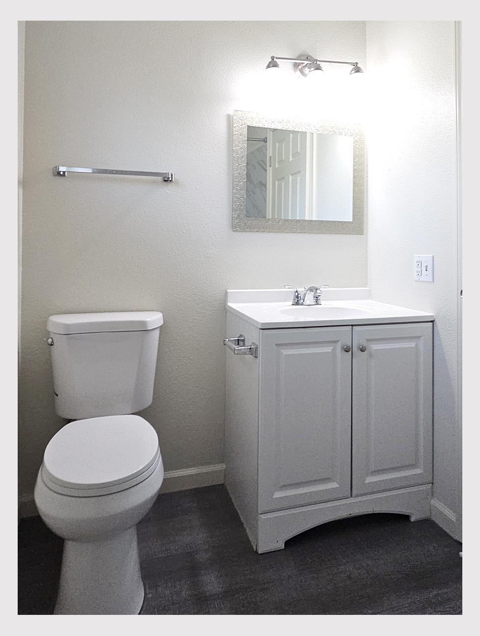 5130 Rescue Court Sacramento, CA 95841 - Photo 21 of 47 a bathroom with a toilet a sink and mirror