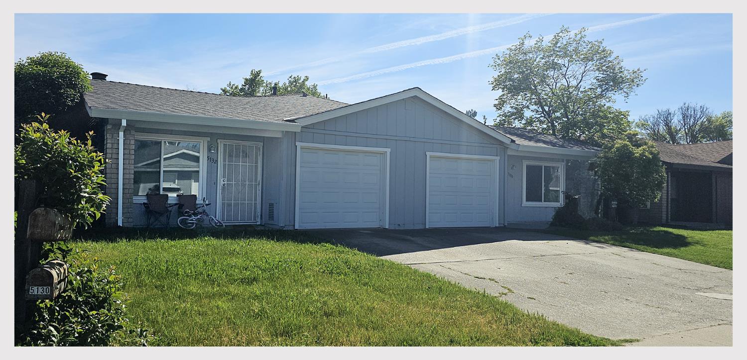 5130 Rescue Court Sacramento, CA 95841 - Photo 3 of 47 a front view of a house with a yard and garage
