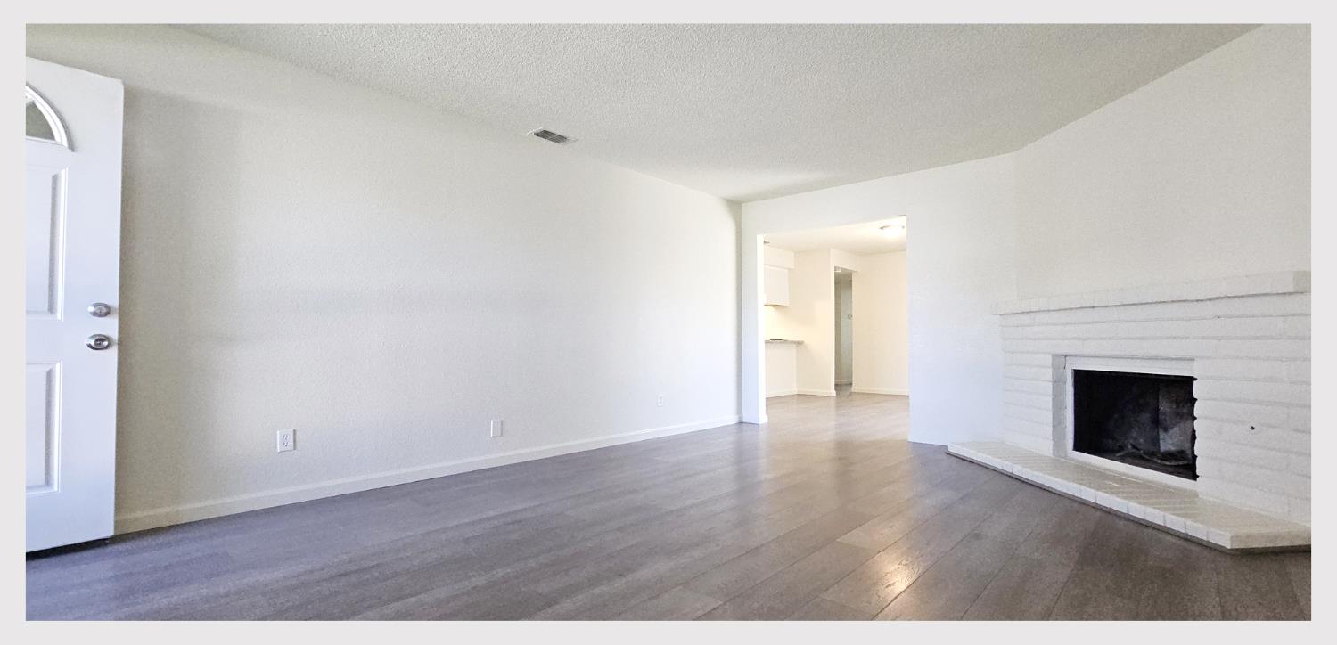 5130 Rescue Court Sacramento, CA 95841 - Photo 4 of 47 a view of an empty room and wooden floor