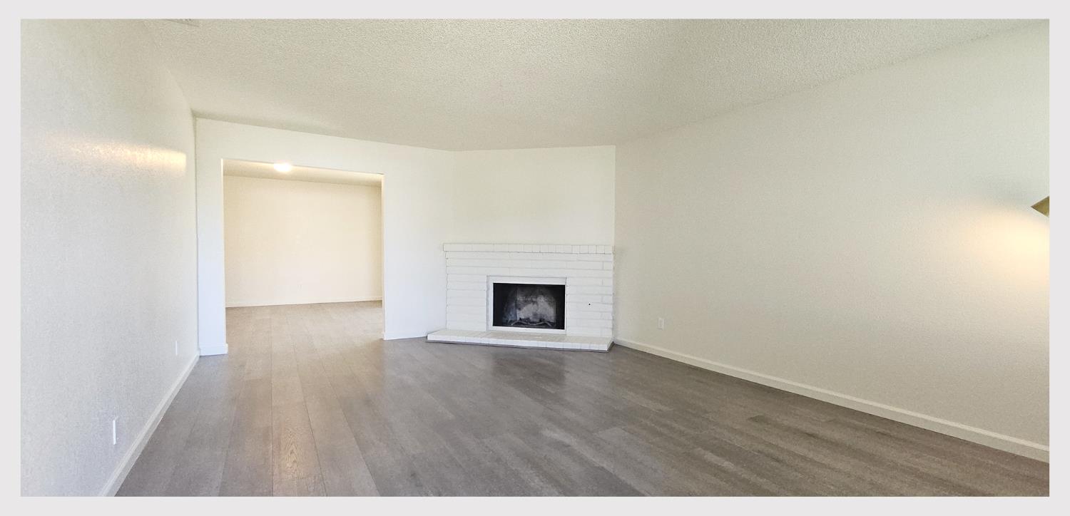 5130 Rescue Court Sacramento, CA 95841 - Photo 5 of 47 a view of an empty room with wooden floor and a window
